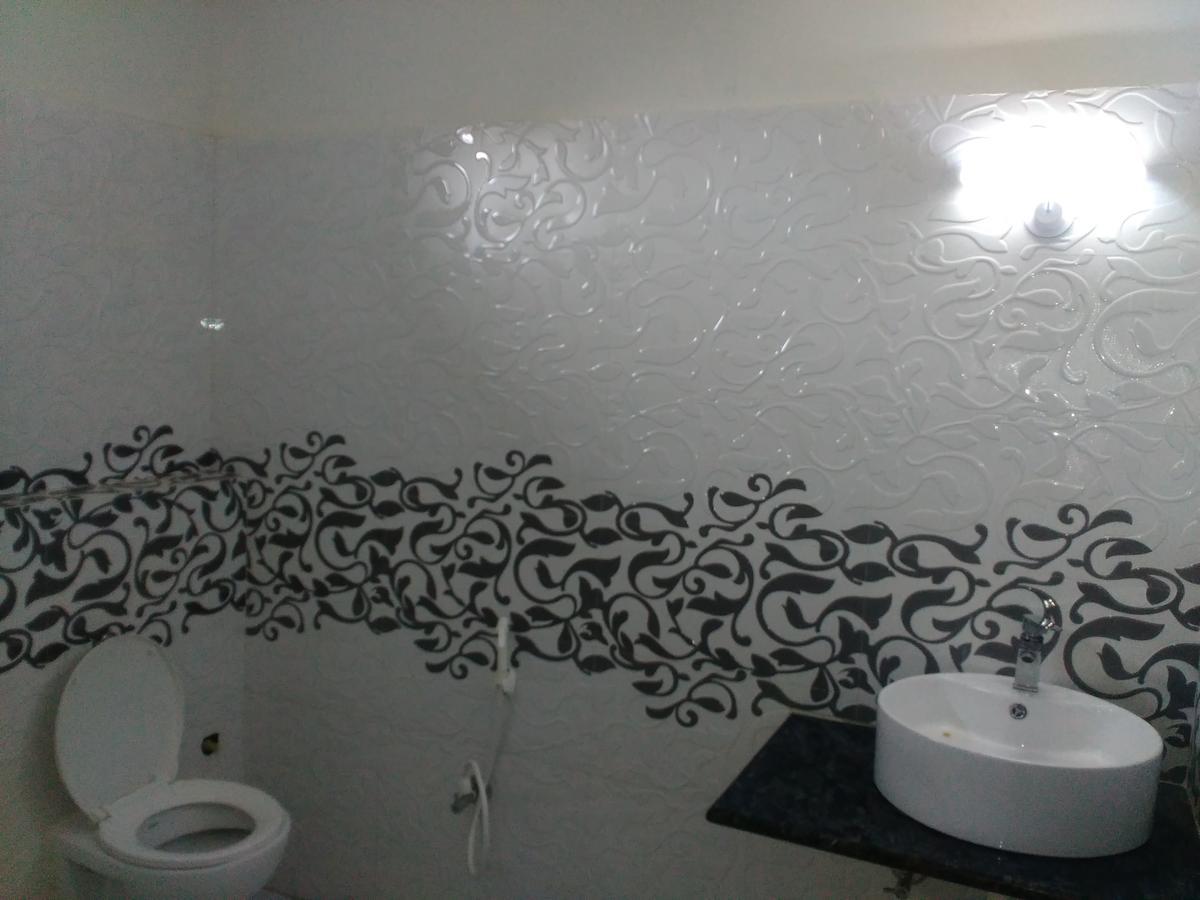 Hotel Rajkamal Диогар Стая снимка